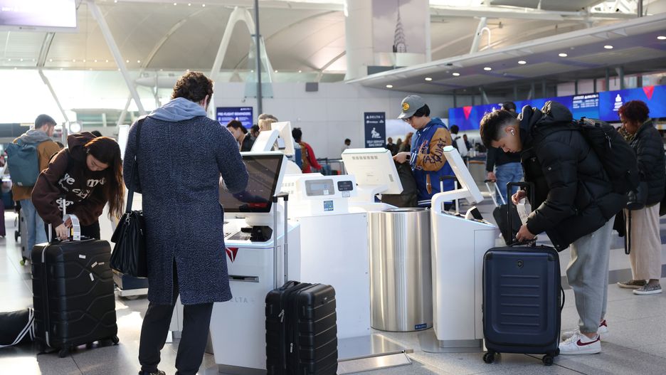 NEW YORK, NEW YORK - NOVEMBER 27: People prepare to travel for the Thanksgiving holiday at John F. Kennedy Airport on November 27, 2024 in New York, New York. The Transportation Security Administration announced that they are prepared for the busiest Thanksgiving travel period on record and are projected to screen 18.3 million people from Tuesday, Nov. 26 to Monday, Dec. 2. (Photo by Michael M. Santiago/Getty Images)