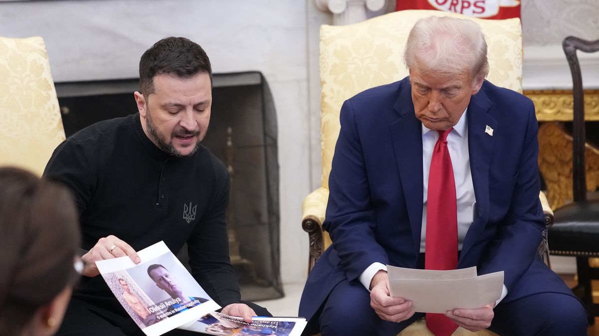 WASHINGTON, DC - FEBRUARY 28: Ukrainian president Volodymyr Zelensky holds photos of Ukrainians who were captures by Russian troops as he meets with U.S. President Donald Trump in the Oval Office at the White House on February 28, 2025 in Washington, DC. Trump and Zelensky are meeting today to sign a preliminary agreement on sharing Ukraine’s mineral resources that Trump says will allow America to recoup aid provided to Kyiv while supporting Ukraine’s economy. (Photo by Andrew Harnik/Getty Images)