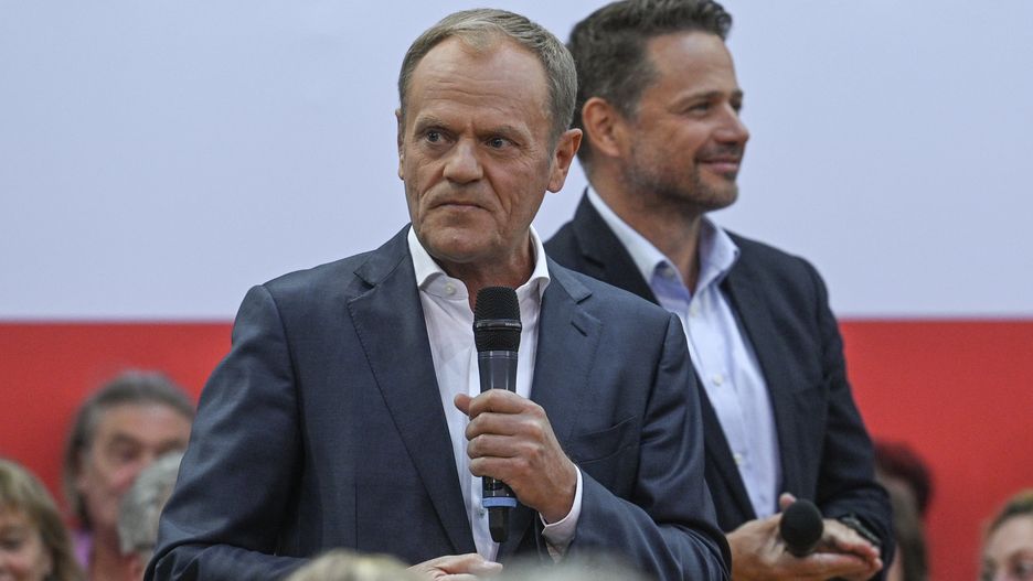 KRAKOW, POLAND - MAY 15, 2023: , Leader of the Civic Platform opposition party, Donald Tusk (L), and Mayor of Warsaw, Rafal Trzaskowski (R), unite in Krakow, sharing vision for Poland's progress, on May 15, 2023, in Krakow, Poland. Chairman Donald Tusk's visit to Krakow marked the 10th stop of the Civic Platform party's tour. The 'Tusk Show' united residents for the #HereIsTheFuture campaign, featuring a mix of familiar and new elements. The dynamic exchange and passionate speeches echoed the March 4th march, rallying all to unite in Warsaw. (Photo by Artur Widak/NurPhoto via Getty Images)