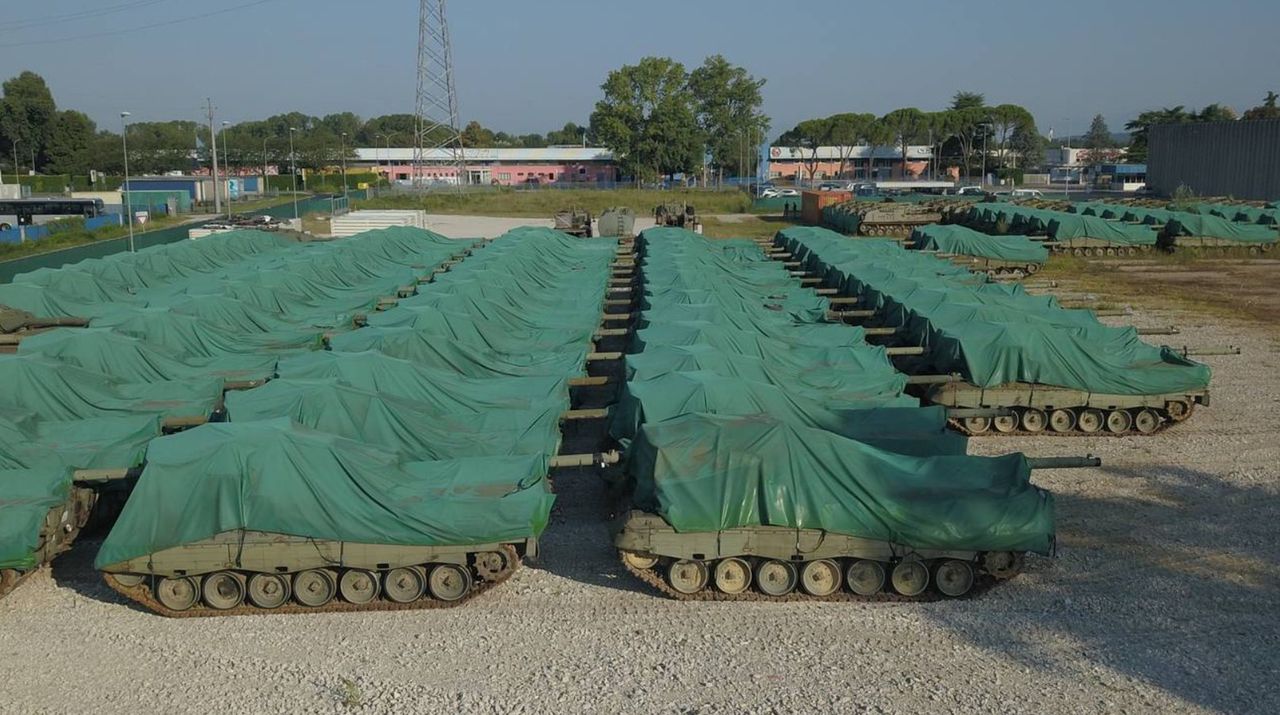 Leopard 1 tanks standing under a tarp in Italy