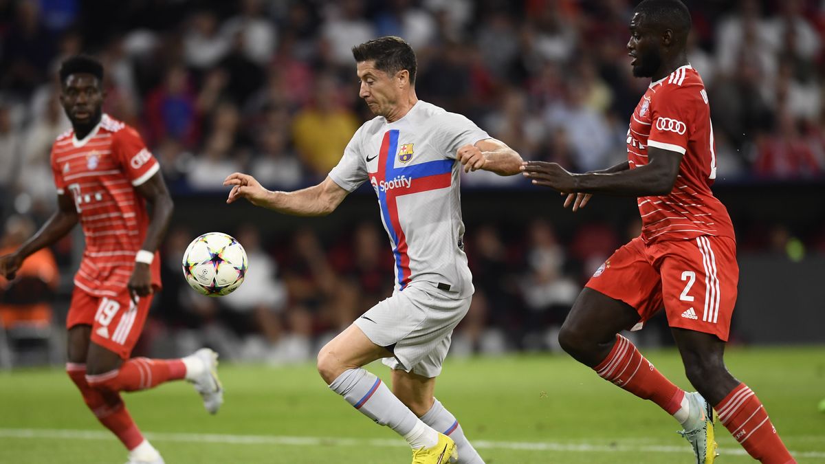 MUNICH, GERMANY - September 13: Robert Lewandowski centre-forward of Barcelona and Poland and Dayot Upamecano Centre-Back of Bayern Munich and France compete for the ball during the UEFA Champions League group C match between FC Bayern MÃ¼nchen and FC Barcelona at Allianz Arena on September 13, 2022 in Munich, Germany. (Photo by Jose Hernandez/Anadolu Agency via Getty Images)