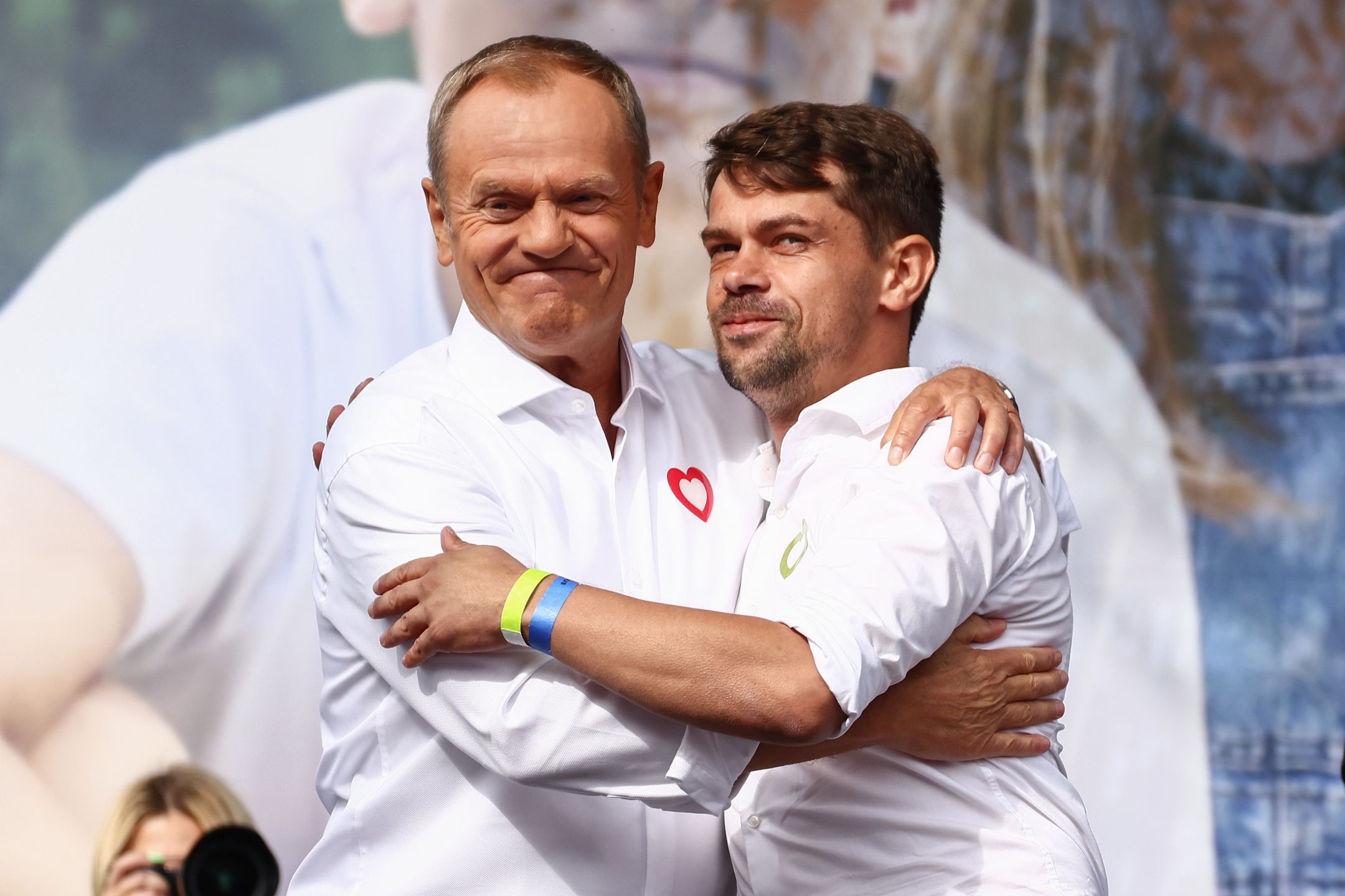 PDonald Tusk, the leader of the Civic Platform party (PO) and Michal Kolodziejczak, the leader of Agrounia union organization of farmers, hug during  'Million Hearts March' organized by Civic Coalition (KO) in Warsaw, Poland on October 1st, 2023. The largest demonstration in recent years in Poland gathered people to protest against Poland's conservative government two weeks ahead of a general election. (Photo by Beata Zawrzel/NurPhoto via Getty Images)