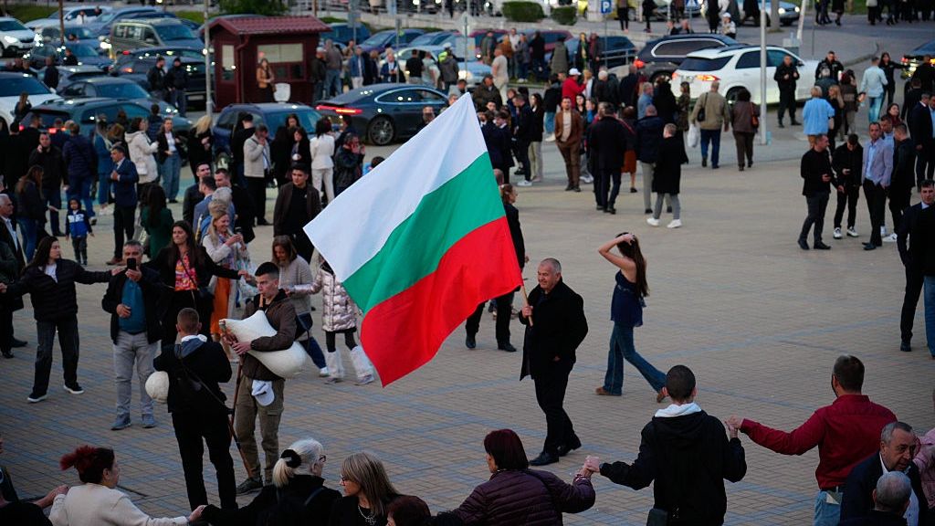 Opposition Leader Rumen Radev Rally In Sofia
A man waves a Bulgarian flag while people perform a dance after a Progressive Bulgaria party rally in Sofia, Bulgaria on 16 April, 2026. Radev's Progressive Bulgaria party leads polls with a wide margin with its main promise of putting an end to corruption. Skeptics worry Radwv's close ties to Russia will make him the Europe's "next Viktor Orban". (Photo by Jaap Arriens/NurPhoto via Getty Images)
NurPhoto
political influence, radev, rally, party leader, skeptics, european politics, polls, jaap arriens, political promise, poland elections, progressive bulgaria, dance, political concerns, progressive bulgaria party, promise, close ties, political ties, political future, poland election, nurphoto, wide margin, elections, april 16, end to corruption, national politics., bulgarian politics, skepticism