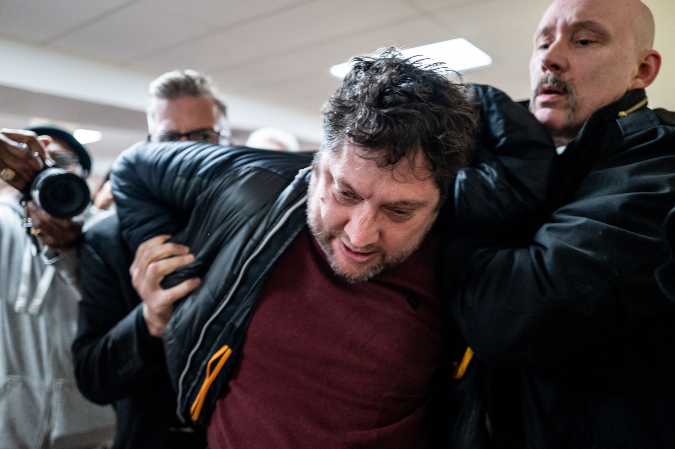ST. PAUL, MINNESOTA - JANUARY 27: A person is subdued after attempting to attack Rep. Ilhan Omar (D-MN) during a town hall meeting at the Urban League Twin Cities facility on January 27, 2026 in Minneapolis, Minnesota. A person holding a syringe charged Omar's podium while she spoke to community members. Protests and demonstrations continue around Minneapolis in the aftermath of the killings of Alex Pretti and Renee Nicole Good by federal law enforcement.  (Photo by Brandon Bell/Getty Images)