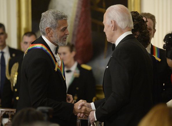 President Biden Hosts Kennedy Center Honorees ReceptionUS President Joe Biden, right, greets actor George Clooney during the Kennedy Center honoree reception in the East Room of the White House in Washington, DC, US, on Sunday, Dec, 4, 2022. The John F. Kennedy Center for the Performing Arts 45th honorees for lifetime artistic achievements include actor and filmmaker George Clooney, contemporary Christian singer-songwriter Amy Grant, singer Gladys Knight, composer and conductor Tania Leon and Irish rock band U2. Photographer: Bonnie Cash/UPI/Bloomberg via Getty ImagesBloombergarts, culture, entertainment, americas, u.s. government, us, 2022uspolitics, u.s.a., government news, united states of america, american, north american