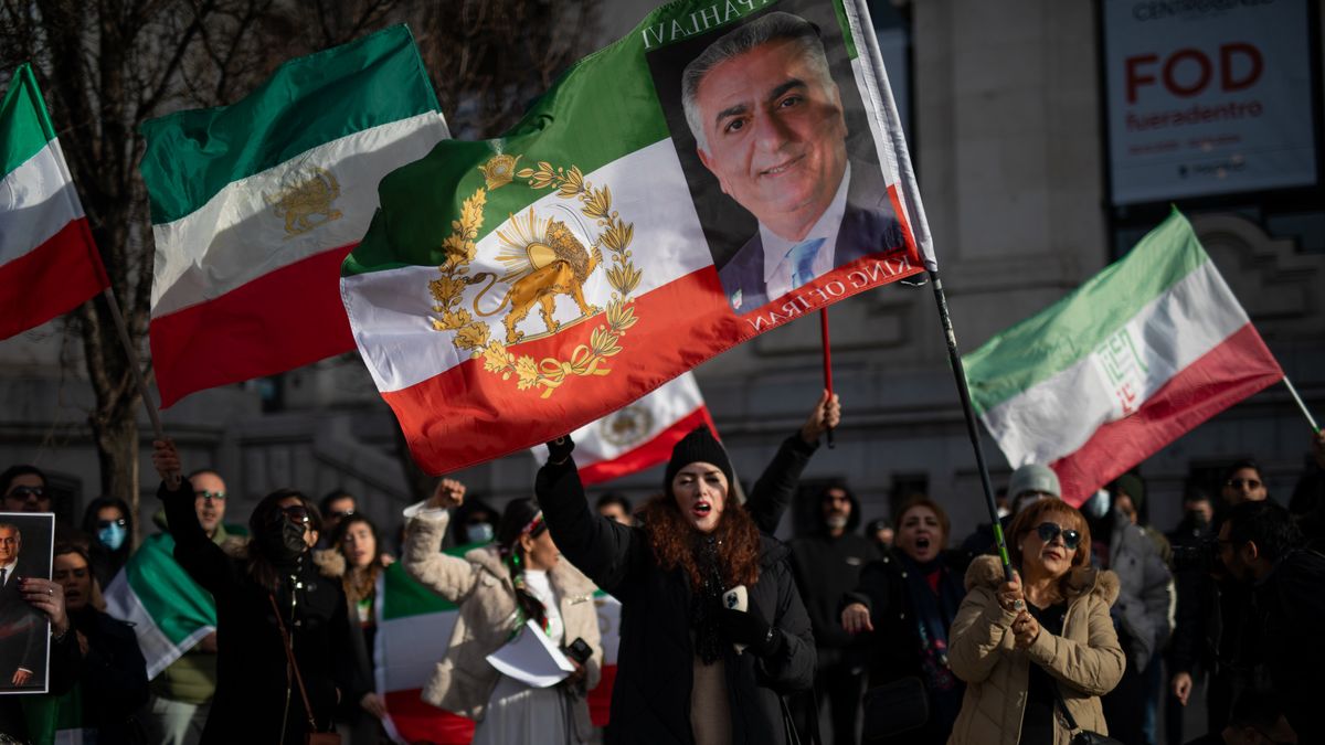 An Iranian supporter holds a flag with the image of Mohammad Reza Pahlavi, who is the Shah of Iran until his overthrow by the Islamic Revolution, during a demonstration in Plaza de Cibeles to denounce the intensification of the Islamic State's repression against the Iranian population in recent weeks. (Photo by David Canales/NurPhoto via Getty Images)