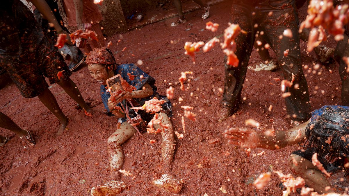 Tomatina 2025
People covered in tomato pulp take part in the 78th 'Tomatina' Festival in Bunol, Spain, on August 27, 2025. They throw a total of 120 tonnes of tomatoes, brought with six trucks, at each other for an hour at the festival. (Photo by Jose Miguel Fernandez/NurPhoto via Getty Images)
NurPhoto
summer event, eastern town, six trucks, jose miguel fernandez, 120 tonnes, messy festival, action shot, tomato battle, tomatoes, tomato-filled streets., festive atmosphere, 78th festival, tomato throwing, tomato festival, tomato pulp, cultural event, crowd, nurphoto, hour-long event, tomato splatter, tomato fight, participants, tomatina festival, unique festival, revelers, tomato-covered, spanish tradition, august 27