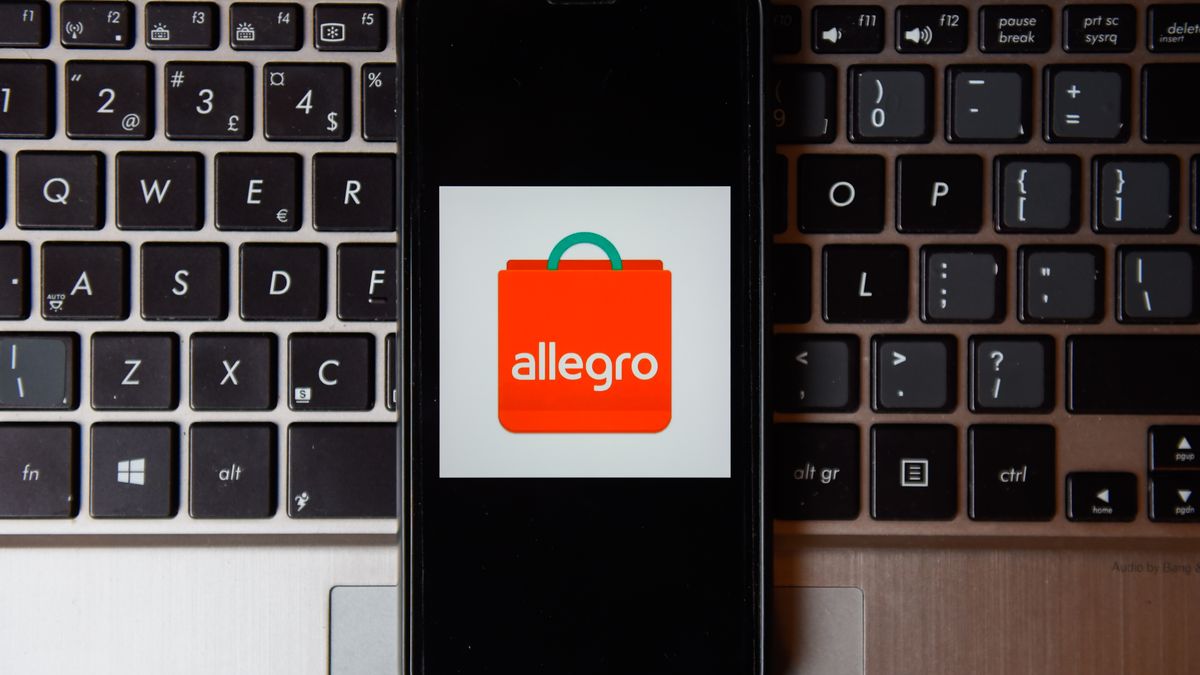 POLAND - 2020/10/21: In this photo illustration an Allegro logo seen displayed on a smartphone with a laptop keyboard on the background. (Photo Illustration by Omar Marques/SOPA Images/LightRocket via Getty Images)