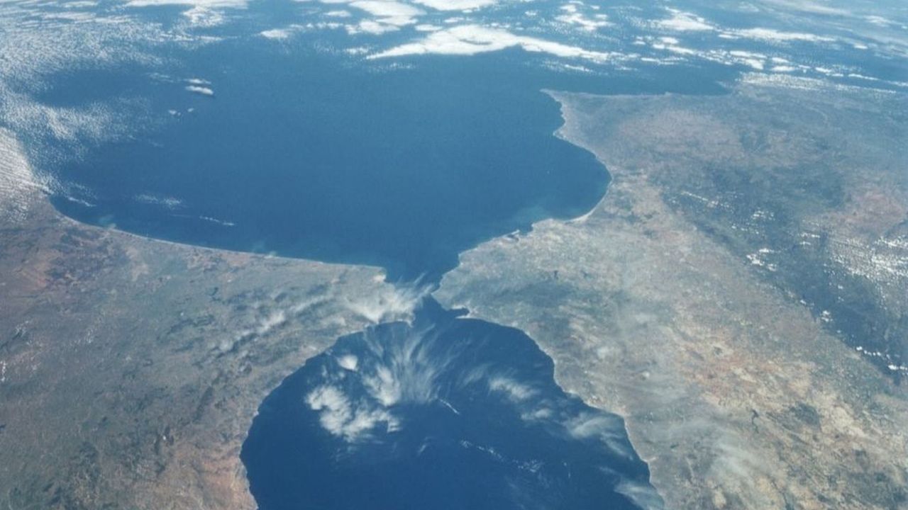 A bird's eye view of the Strait of Gibraltar, which forms a narrow corridor between the Atlantic Ocean and the Mediterranean Sea.