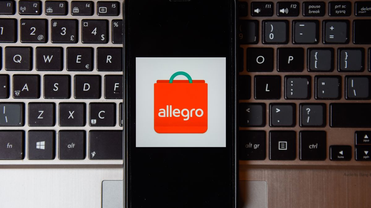 POLAND - 2020/10/21: In this photo illustration an Allegro logo seen displayed on a smartphone with a laptop keyboard on the background. (Photo Illustration by Omar Marques/SOPA Images/LightRocket via Getty Images)