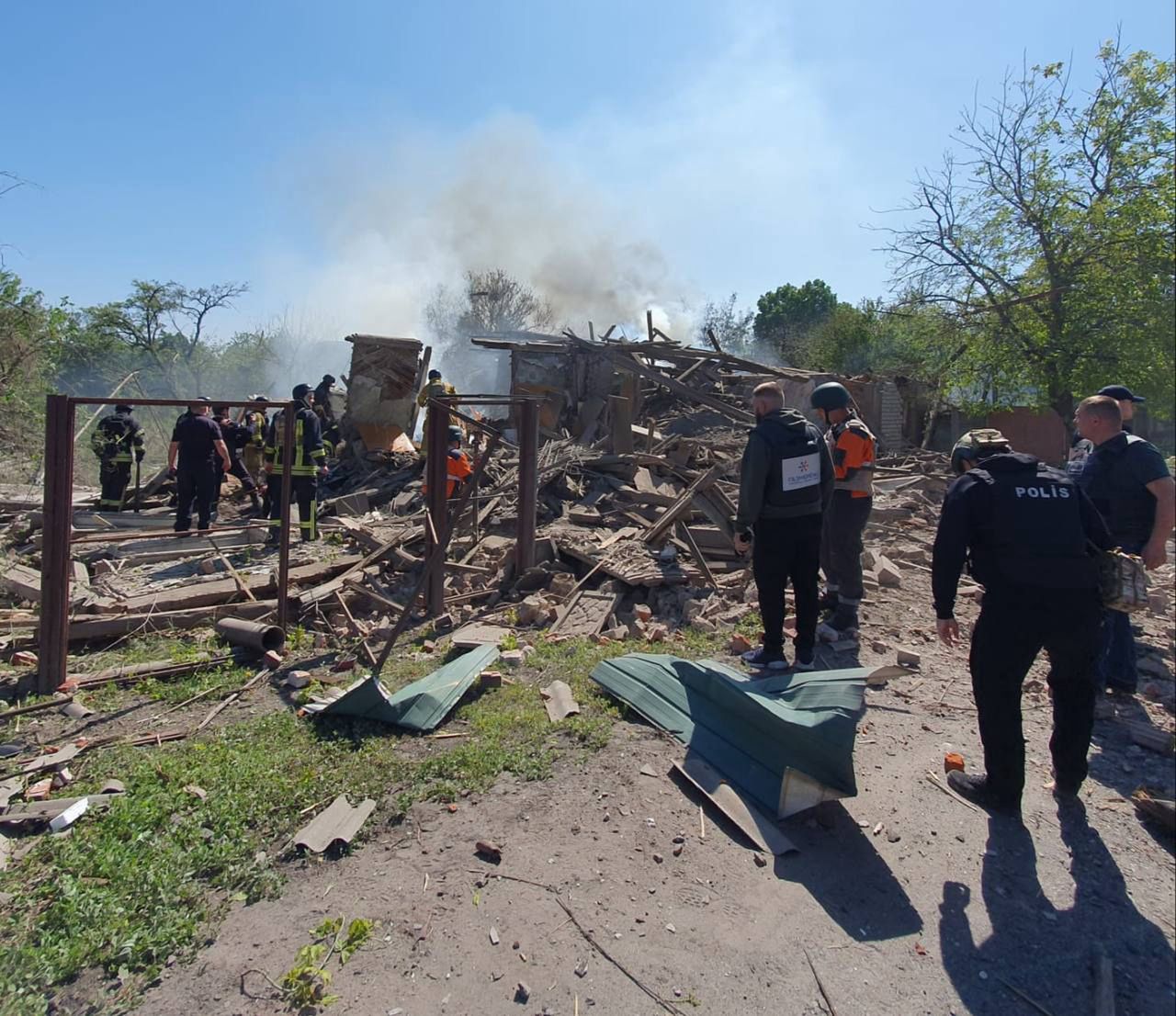 A tragic air strike hits Kharkiv's heart, building in ruins.