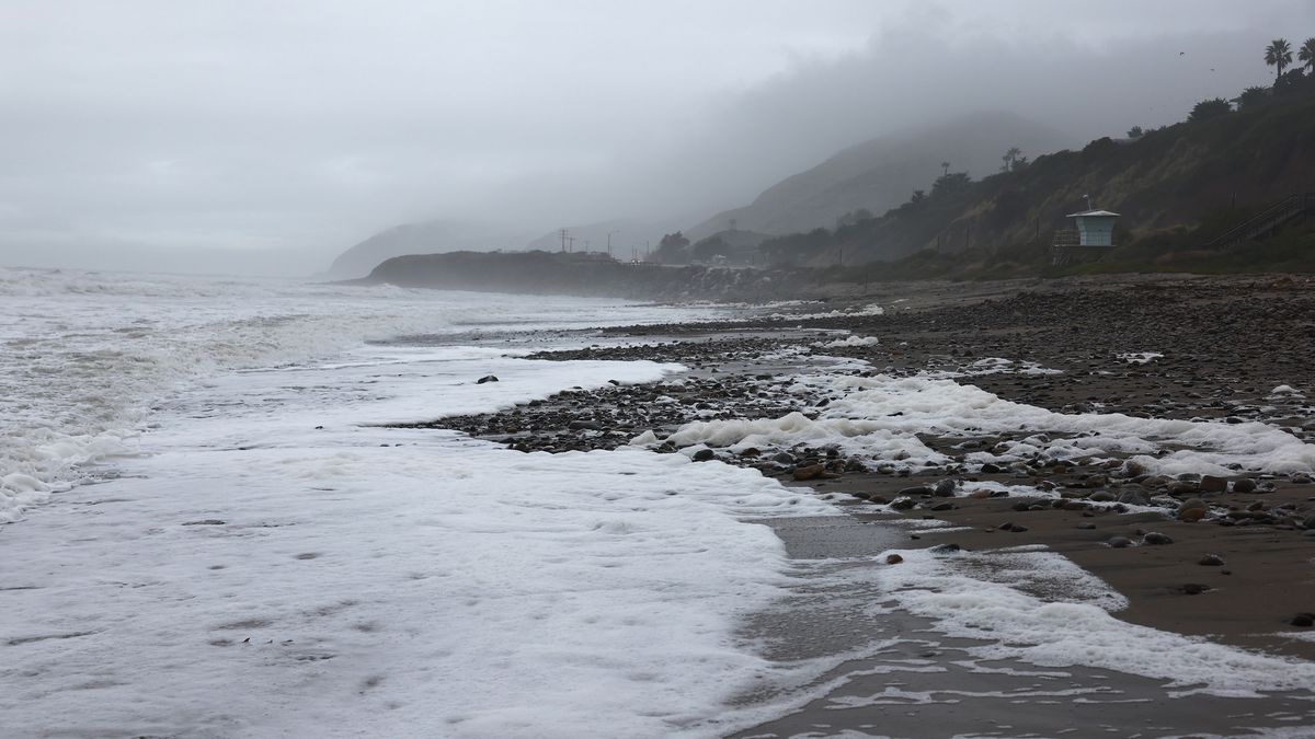 MALIBU, CALIFORNIA - FEBRUARY 05: Rain continues to fall as Pacific Ocean waves come ashore as a powerful long-duration atmospheric river storm, the second in less than a week, continues to impact Southern California on February 5, 2024 near Malibu, California. The storm is delivering widespread flooding, landslides and power outages while dropping heavy rain and snow across the region. (Photo by Mario Tama/Getty Images)