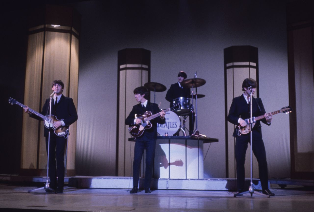 The Beatles during a concert.