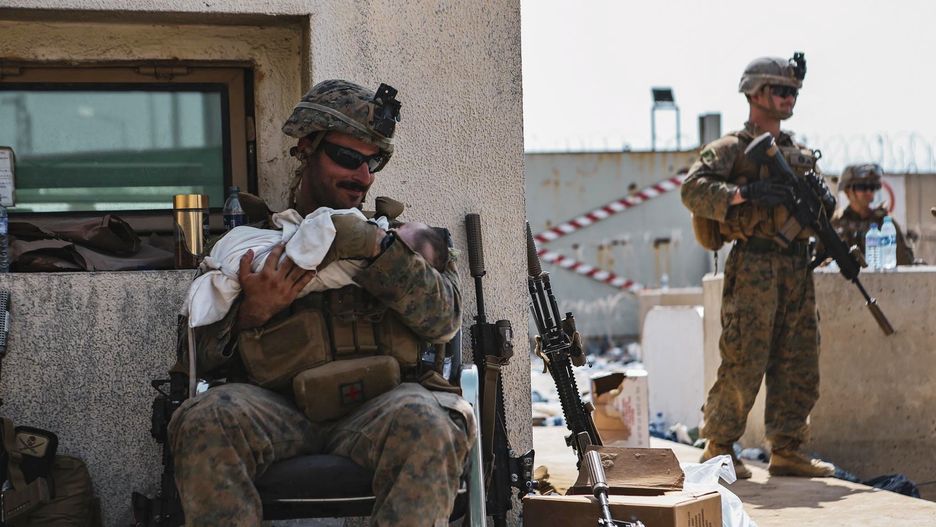 Evacuation at Hamid Karzai International AirportAugust 20, 2021, Kabul, USA: A Marine assigned to the 24th Marine Expeditionary Unit (MEU) calms an infant during an evacuation at Hamid Karzai International Airport, Kabul, Afghanistan, August 20, 2021. US service members and coalition partners are assisting the US Department of State with a Non-combatant Evacuation Operation (NEO) in Afghanistan. .,Image: 628118053, License: Rights-managed, Restrictions: , Model Release: no, Credit line: Isaiah Campbell - US Marine Corp / Zuma Press / ForumIsaiah Campbell - US Marine Corp / Zuma Press / Forumzs2ap, 082021_DoD-Afghanistan-Release_015.jpg, Press, 20210820_zaa_s152_052.jpg, category_code_new