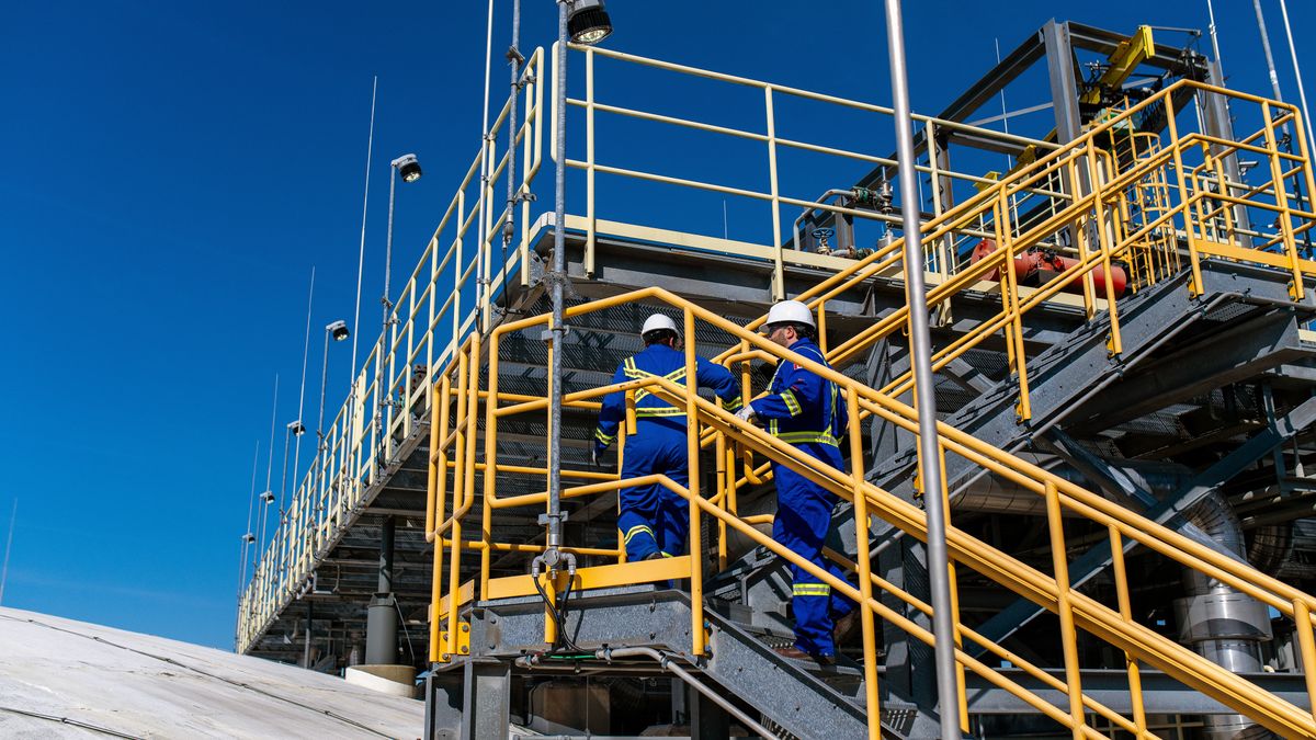 Workers on top of a refrigerated propane storage tank at the AltaGas Ridley Island Propane Export Terminal near Prince Rupert, British Columbia, Canada, on Wednesday, July 16, 2025. The facility is Canada's first propane export facility and the closest North American LPG terminal to Asia. Photographer: James MacDonald/Bloomberg via Getty Images