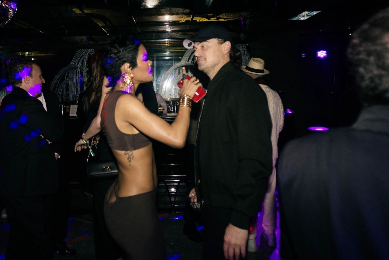 Leonardo DiCaprio and Teyana Taylor chat at the party.