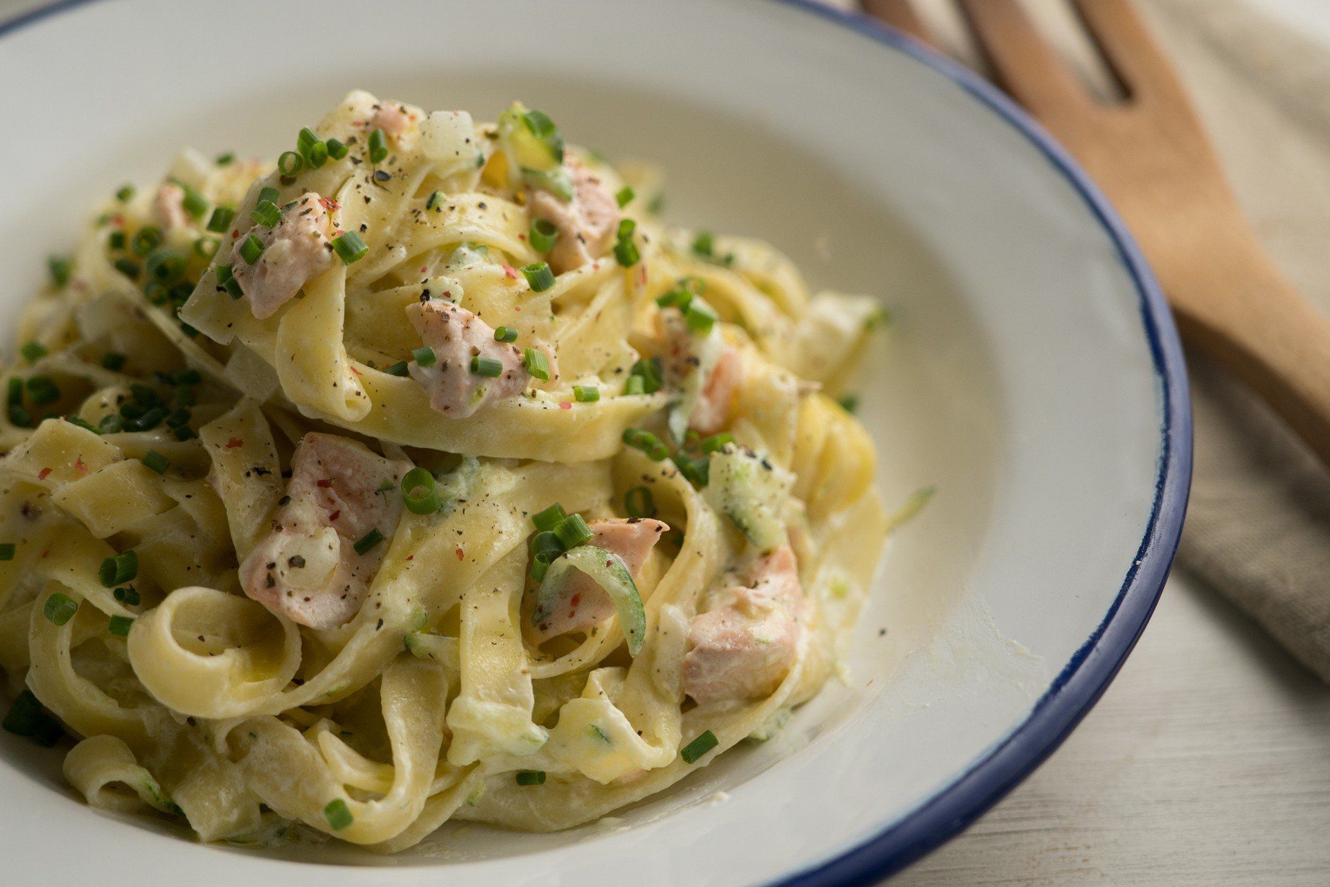 Tagliatelle pasta dish with salmon and zucchini