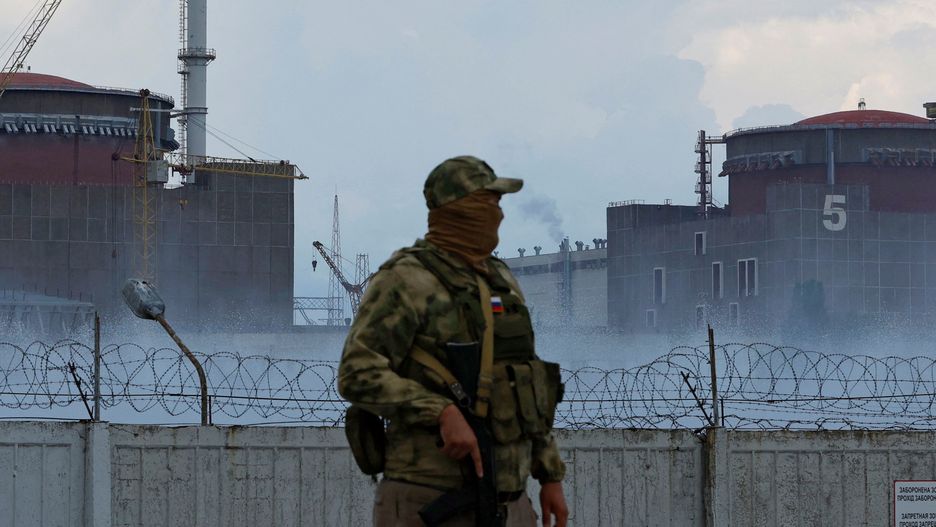 Zaporizhzhia Nuclear Power Plant near EnerhodarA serviceman with a Russian flag on his uniform stands guard near the Zaporizhzhia Nuclear Power Plant in the course of Ukraine-Russia conflict outside the Russian-controlled city of Enerhodar in the Zaporizhzhia region, Ukraine August 4, 2022.,Image: 712182993, License: Rights-managed, Restrictions: , Model Release: no, Credit line: ALEXANDER ERMOCHENKO / Reuters / ForumALEXANDER ERMOCHENKO / Reuters / Forumenergy and resource, war, energy, category_code_nrg, category_code_europ, category_code_enr, category_code_war, category_code_energy and resource, category_code_energy
