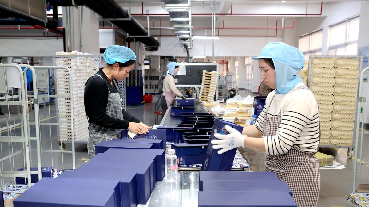 SUQIAN, CHINA - DECEMBER 29: Employees work on the production line at the workshop of Jiangsu Hongya Packaging Technology Co., Ltd. on December 29, 2025 in Suqian, Jiangsu Province of China. (Photo by Wang Li/VCG via Getty Images)