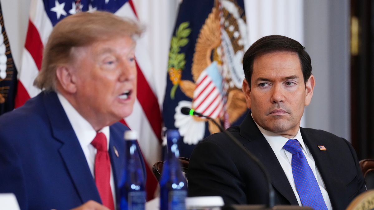WASHINGTON, DC - AUGUST 07: U.S. Secretary of State Marco Rubio (R) listens as U.S. President Donald Trump speaks during a roundtable on the American mining industry at the U.S. Department of State on August 07, 2026 in Washington, DC. Trump attended the event as his administration aims to secure additional supplies of critical minerals in an effort to replenish weapons stockpiles that have been depleted during the U.S. conflict with Iran.  (Photo by Eric Lee/Getty Images)