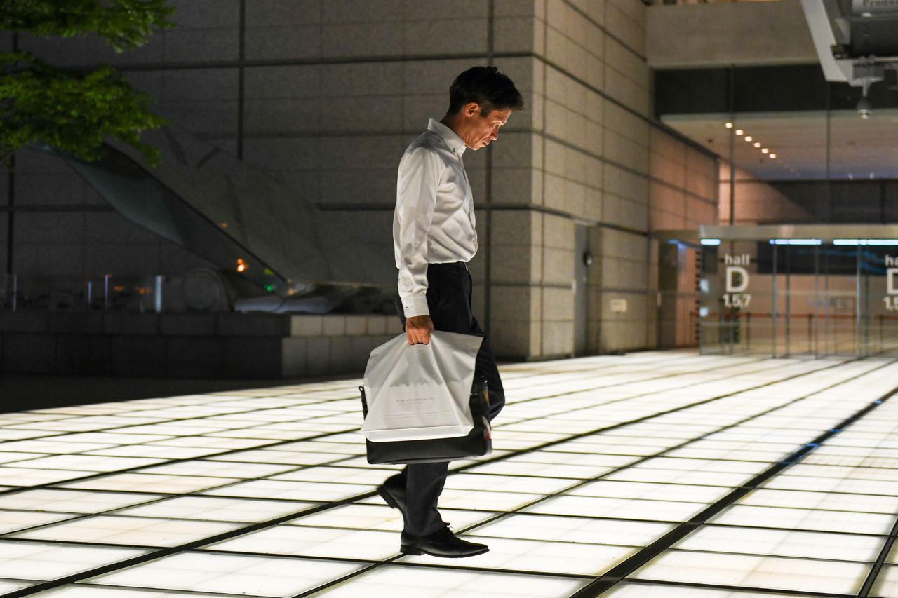 A pedestrian in Tokyo, Japan, on Friday, Aug. 2, 2024. Conditions in Japan's labor market stayed tight in June, a development likely to keep sustained upward pressure on wages as companies compete to hire and retain workers. Photographer: Noriko Hayashi/Bloomberg via Getty Images