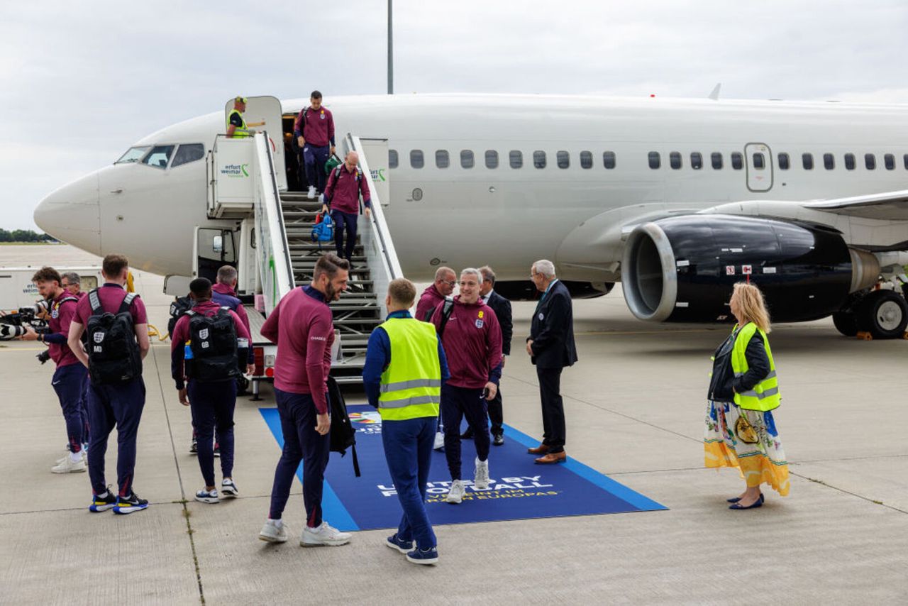 the England team disembarking from the plane