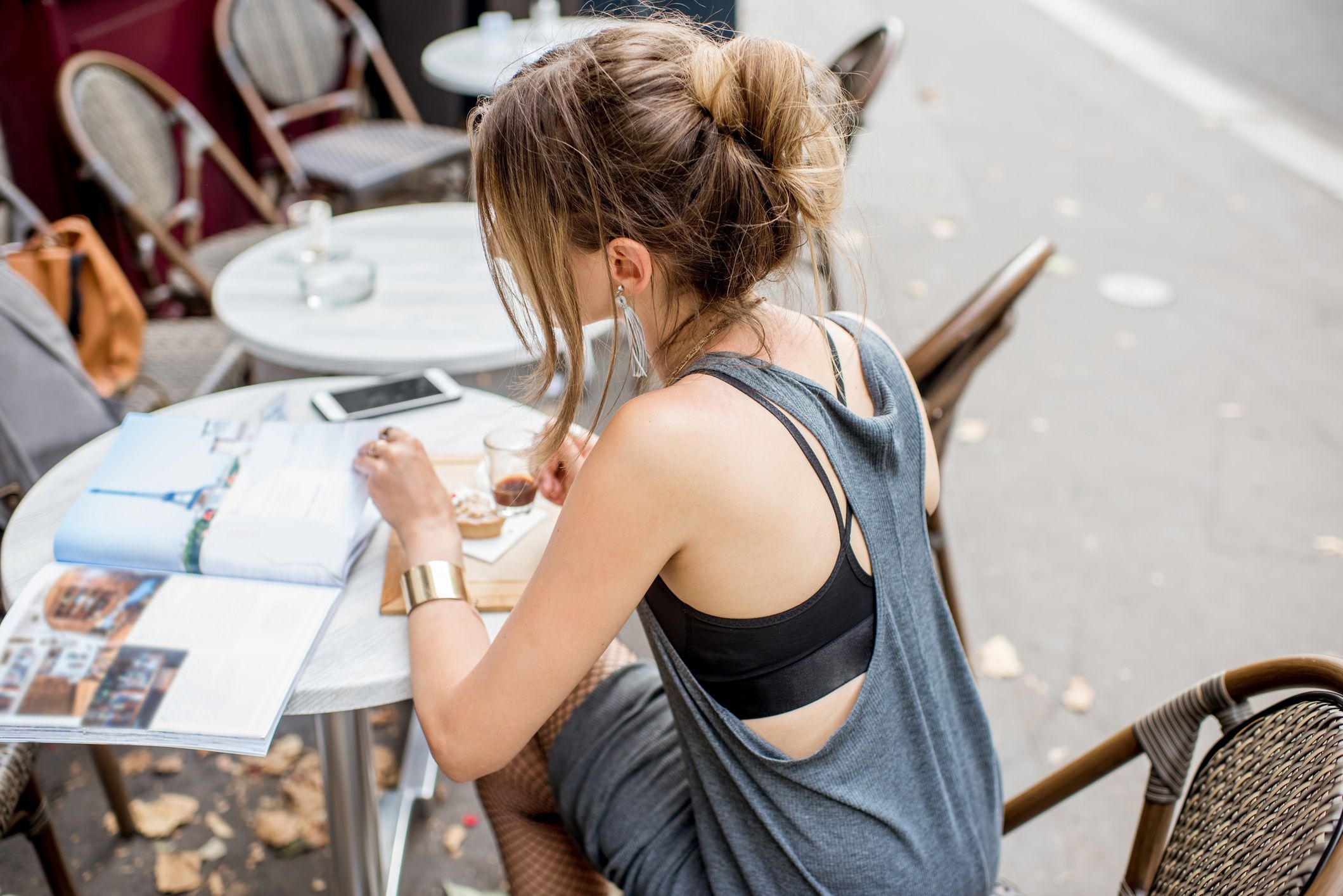 Elegant woman sitting at the french cafe
Back view on the young stylish woman drinking coffee outdoors at the cafe in Paris
RossHelen