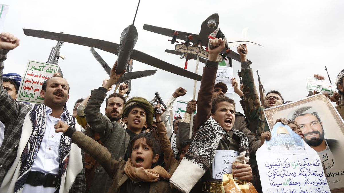 SANA'A, YEMEN - MAY 2: Yemenis brandish weapons, mock drones and chant slogans during a mass protest against US airstrikes, which have reportedly killed civilians, and in solidarity with people in the Gaza Strip on May 2, 2025 in Sana'a, Yemen. The US has continued an airstrike campaign known as "Operation Rough Rider," targeting Yemen's Iran-backed Houthi rebel group, following negotiations between the Trump administration and Tehran over Iran's nuclear program. (Photo by Mohammed Hamoud/Getty Images)