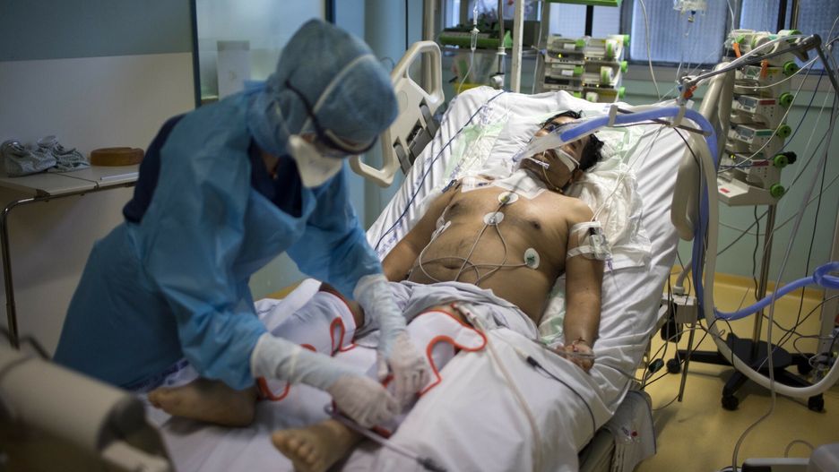 arch42A nurse tends to a COVID-19 patient in the intensive care unit at the Joseph Imbert Hospital Center in Arles, southern France, Wednesday, Oct. 28, 2020. Many French doctors are urging a new nationwide lockdown, noting that 58% of the country's intensive care units are now occupied by COVID patients and medical staff are under increasing strain. (AP Photo/Daniel Cole)AP