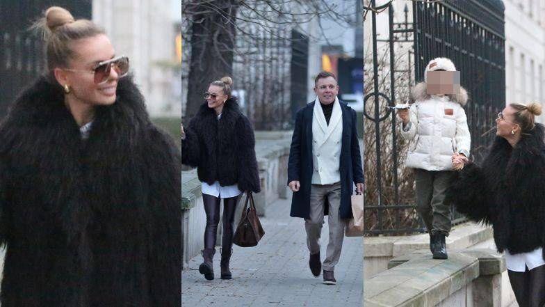 Odziana w czarne futro Izabela Janachowska kroczy dumnie obok mę