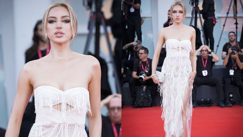 Caroline Derpienski w bieli na festiwalu w Wenecji