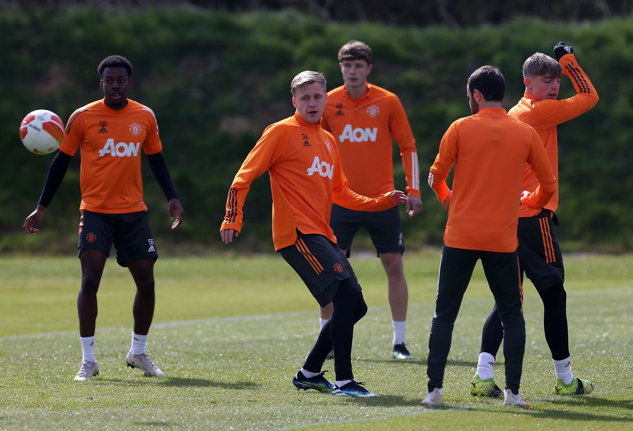 MANCHESTER, ENGLAND - APRIL 13: (EXCLUSIVE COVERAGE) Anthony Elanga, Donny van de Beek, Will Fish of Manchester United in action during a first team training session at Aon Training Complex on April 13, 2021 in Manchester, England. (Photo by Matthew Peters/Manchester United via Getty Images)