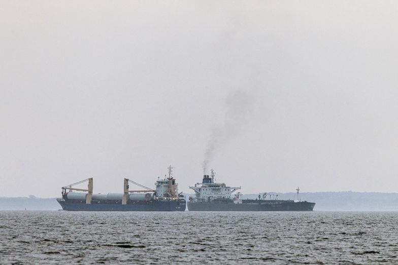 The shadow fleet tanker Turbo Voyager, right, passes within 600 meters of a general cargo vessel as it transits through the Great Belt of Denmark off the coast of Agerso, Denmark, on Thursday, Aug. 15. 2024. On the small Danish island of Agerso, fisherman and beach-goers see old tankers carry Russian oil through Denmark's narrow straits on a daily basis. Photographer: Carsten Snejbjerg/Bloomberg via Getty Images