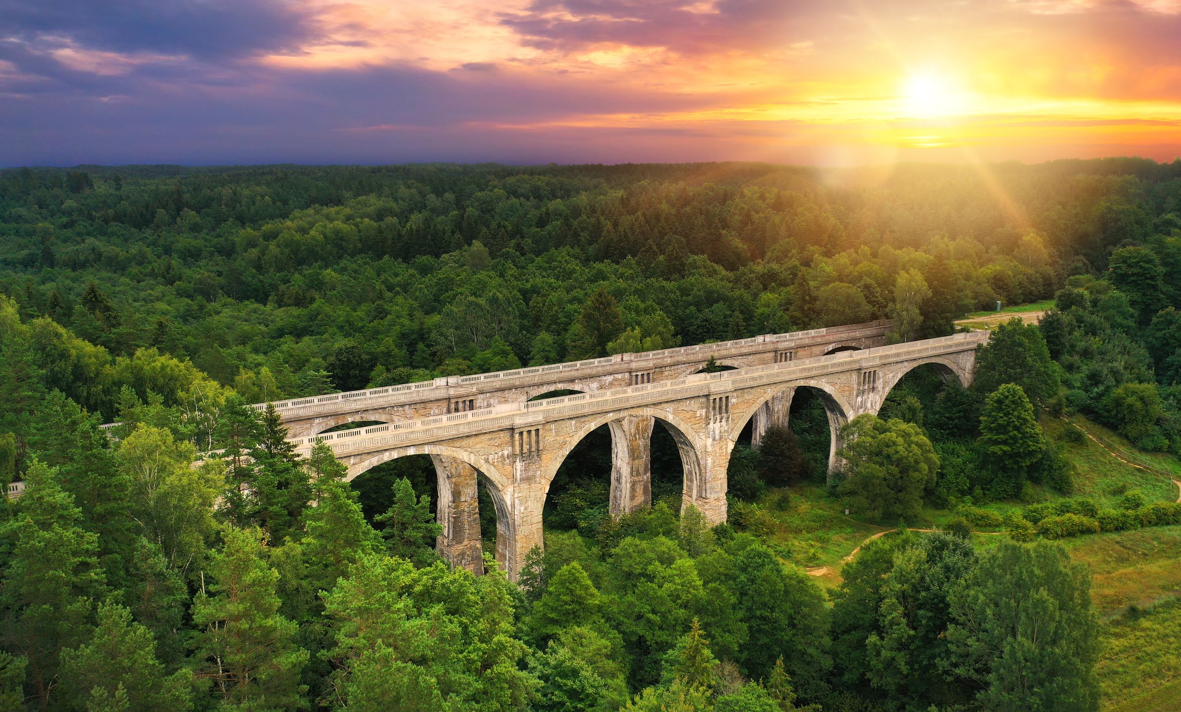 Famous stone bridges in Stanczyki village - Podlasie, Polandstanczyki, bridge, stanczykach, suwalszczyzna, stone, aerial, drone, high, view, poland, train, old, architecture, ancient, forest, trees, green, building, landmark, landscape, sunset, sunrise, morning, sunny, sunlight, scenery, scenic, summer, podlaskie, podlasie, medieval, aqueduct, village, knyszynska, wilderness, green, canopies, ruins, voivodeship, tourism, europe, history, arch, travel, heritage, viaduct, historic, roman, transportation, stanczyki, bridge, stanczykach, suwalszczyzna, stone, aerial, drone, high, view, poland, train, old, architecture, ancient, forest, trees, green, building, landmark, landscape, sunset, sunrise, morning, sunny, sunlight, scenery, scenic, summer, podlaskie, podlasie, medieval, aqueduct, village, knyszynska, wilderness, canopies, ruins, voivodeship, tourism, europe, history, arch, travel, heritage, viaduct, historic, roman, transportation