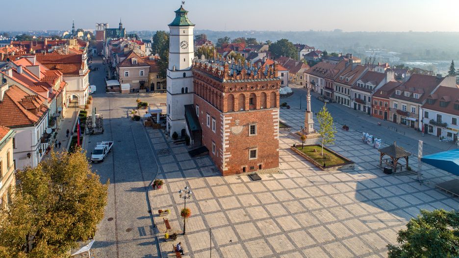 Sandomierz old city, Poland. Aerial view in sunrise light. Gothic city hall with clock tower and Renaissance attic and St Mary statue in the market Square (Rynek). One of the oldest towns in Poland.
Krzysztof Nahlik
Sandomierz, Poland, city hall, town hall, clock tower, market square, old city, old town, Gothic, medieval, Renaissance, city, town, building, st Mary, statue, monument, Europe, European, architecture, history, urban, historical, sightseeing, pavement, blue sky, tree, brick, red, vacation, landmark, tourist attraction, travel, tourism, wall, historic, monument, Polish, sidewalk, house, old, oldest, sandomierz, poland, city hall, town hall, clock tower, market square, old city, old town, gothic, medieval, renaissance, city, town, building, st mary, statue, monument, europe, european, architecture, history, urban, historical, sightseeing, pavement, blue sky, tree, brick, red, vacation, landmark, tourist attraction, travel, tourism, wall, historic, polish, sidewalk, house, old, oldest