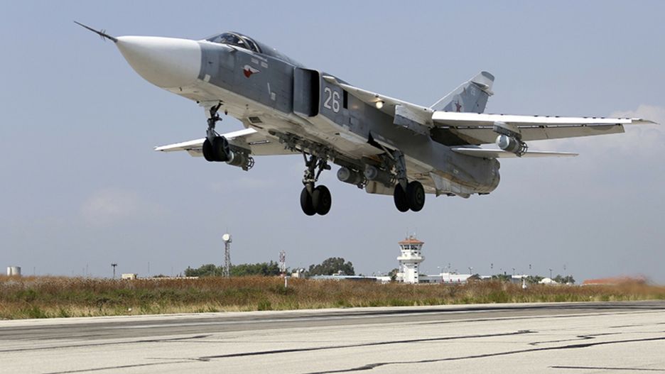 Pierwsze rosyjskie naloty w Syrii
In this photo taken from Russian Defense Ministry official web site on Tuesday, Oct. 6, 2015, a Russian  SU-24M jet fighter takes off from an airbase Hmeimim in Syria. A spokeswoman for the Russian foreign ministry has rejected claims that Russia in its airstrikes in Syria is targeting civilians or opposition forces. (Russian Defense Ministry Press Service via AP)
Russian Defense Ministry Press Service
