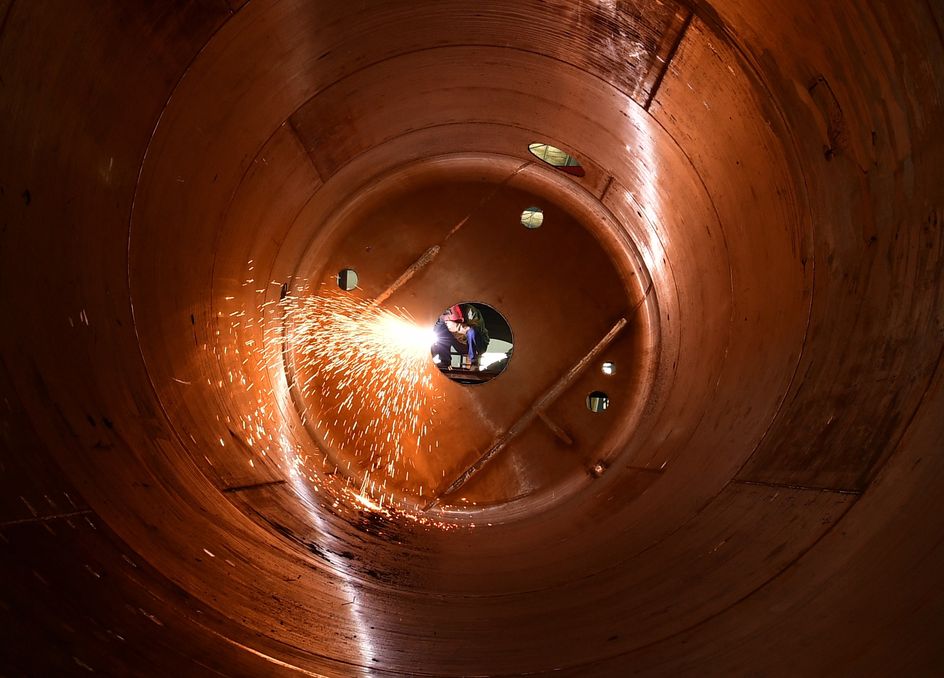 HAIAN, CHINA - APRIL 22, 2024 - Workers produce chemical modules for export in the workshop of a pressure vessel company in Haian, Jiangsu province, China, April 22, 2024. (Photo credit should read CFOTO/Future Publishing via Getty Images)
