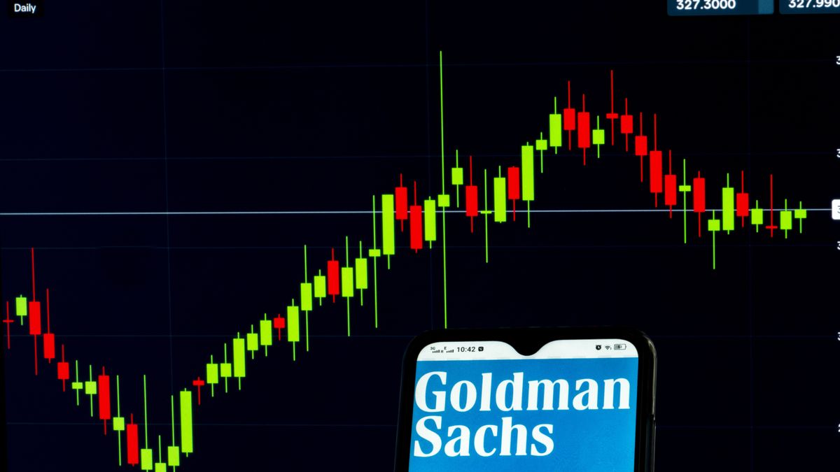 UKRAINE - 2021/04/08: In this photo illustration, Goldman Sachs Group, Inc. logo seen displayed on a smartphone with the stock market information of Goldman Sachs Group, Inc. in the background. (Photo Illustration by Igor Golovniov/SOPA Images/LightRocket via Getty Images)