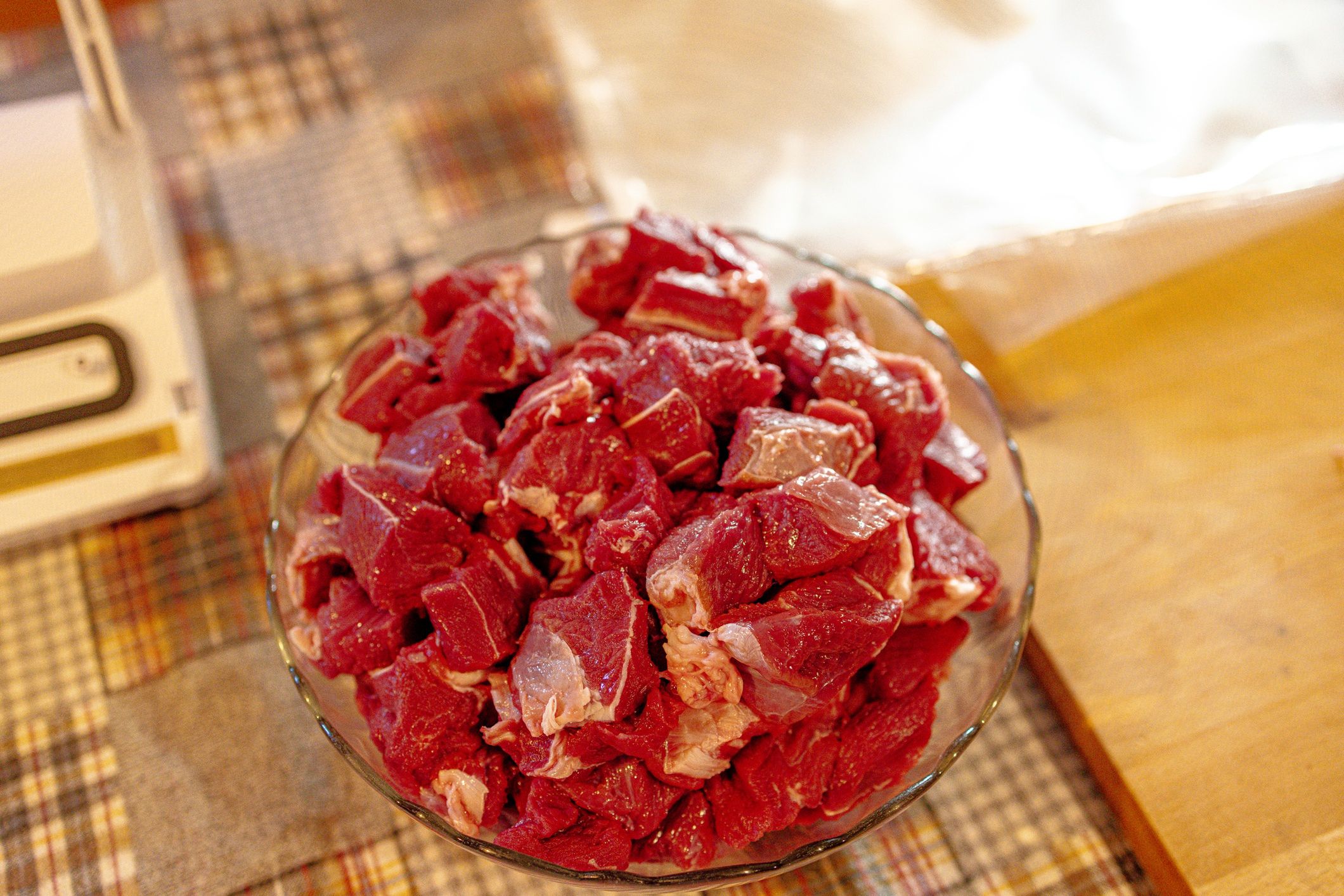 Fresh beef cut in smaller pieces set in a glass bowl
Fresh beef cut in into pieces set in a glass bowl on the kitchen table.
BAMM-BAMM