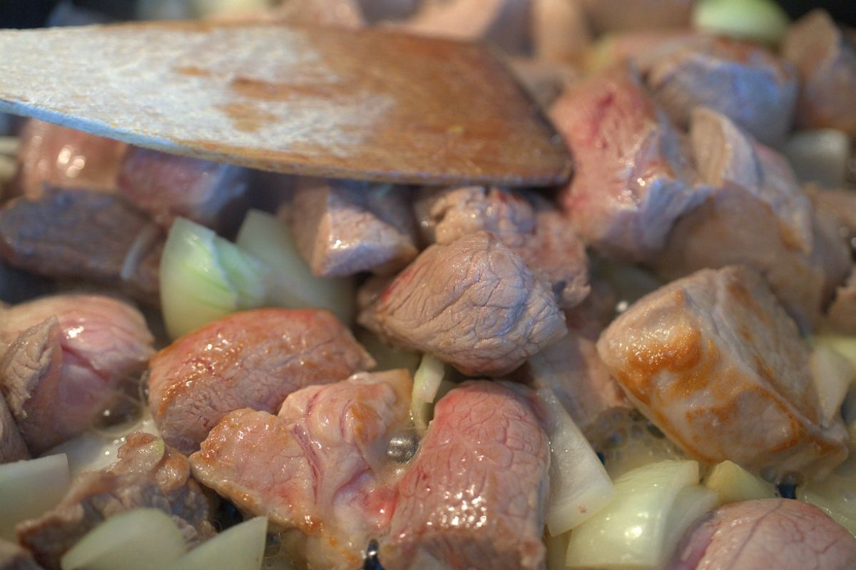 The pot is filled to the brim with aromatic meat.