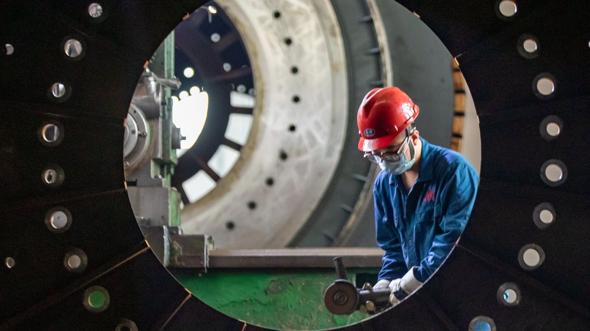 HAIAN, CHINA - JULY 19, 2022 - A worker rushes to manufacture construction machinery for the domestic and international at a workshop of Pengfei Group in Dagong Town, Haian City, East China's Jiangsu Province, July 19, 2022. Pengfei Group has exported products to more than 70 countries and built "one-stop" turnkey projects. Among them, 50 are countries along the Belt and Road. (Photo credit should read CFOTO/Future Publishing via Getty Images)