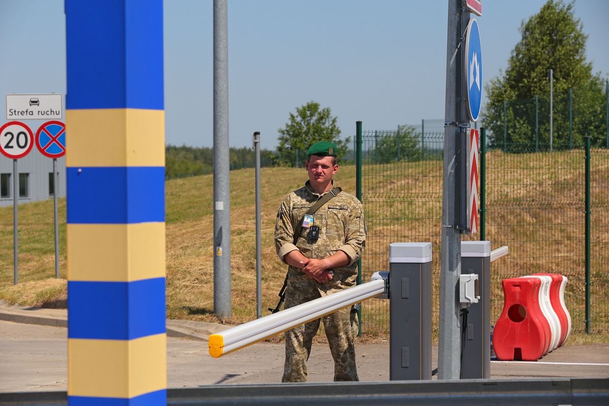 LVIV REGION, UKRAINE - JUNE 20, 2022 - A border guard is on duty at the Krakovets-Korczowa checkpoint at the Ukraine-Poland border that was upgraded under the Open Border project, Lviv Region, western Ukraine. Ukraine and Poland have agreed to enhance capacity at the Krakovets-Korczowa checkpoint by at least 50% in the coming weeks as part of the Open Border project, including by increasing the number of lanes for trucks and creating additional pavilions for customs and passport control. This photo cannot be distributed in the Russian Federation. (Photo credit should read Alona Nikolaievych/Ukrinform/Future Publishing via Getty Images)