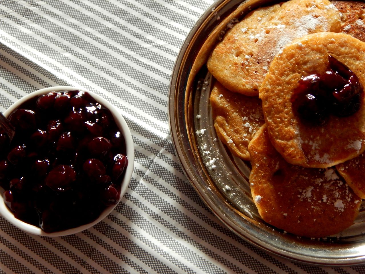 These pancakes taste great with cherries.