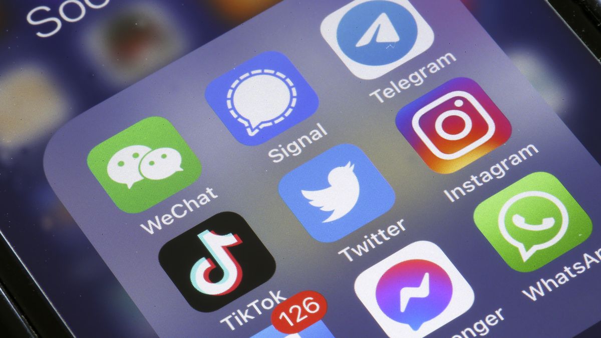 PARIS, FRANCE - APRIL 26: In this photo illustration, the logos of social media applications, Instagram, WhatsApp, Messenger, WeChat, Signal, Telegram, TikTok and Facebook are displayed on the screen of an iPhone  on April 26, 2022 in Paris, France. The U.S. multi-billionaire Elon Musk bought the social network Twitter on Monday April 25 for the sum of 44 billion dollars after two weeks of arm wrestling with the company's board of directors. (Photo illustration by Chesnot/Getty Images)