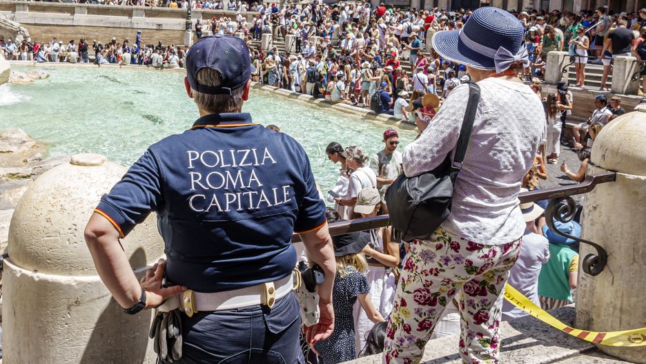 Rome, Italy, Piazza di Trevi, Trevi Fountain, Fontana di Trevi, Baroque design architect Nicola Salvi, large crowd of tourists with Church of Saint Vincent and Anastasius in background. (Photo by: Jeffrey Greenberg/Universal Images Group via Getty Images)