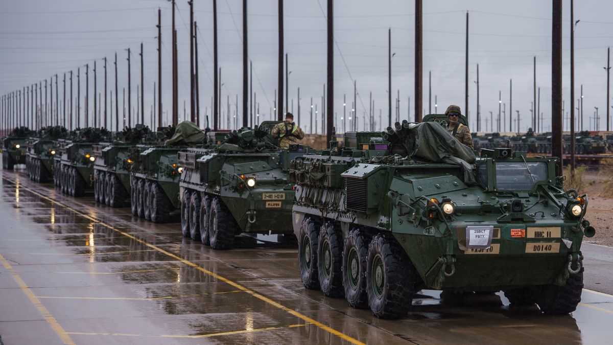 U.S. Army soldiers prepare to move Stryker armored infantry transport vehicles from a rail head to a parking area, where they will be prepared to deploy along the U.S.-Mexico border as part of the military's Joint Task Force Southern Border mission, at Fort Bliss in El Paso, Texas on Saturday, April 5, 2025.
