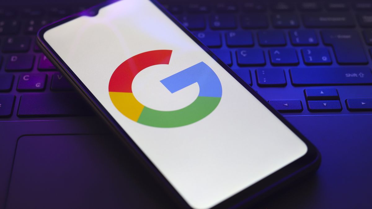 The Google logo appears on the screen of a smartphone that rests on top of a laptop keyboard in Reno, United States, on November 28, 2024. (Photo by Jaque Silva/NurPhoto via Getty Images)