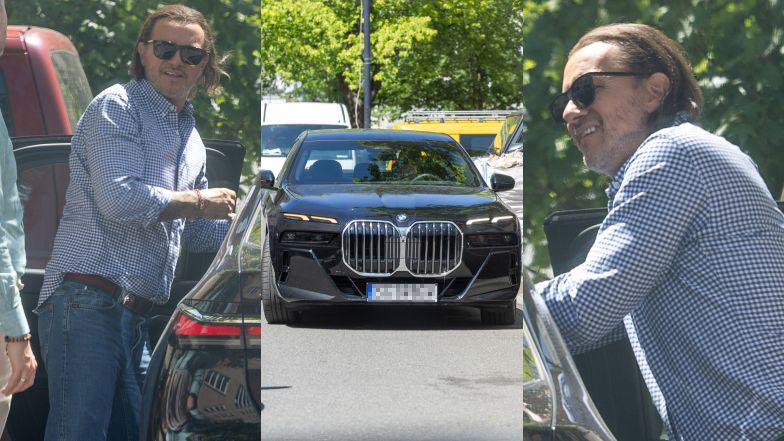 Radosław Majdan parkuje BMW na ulicy
