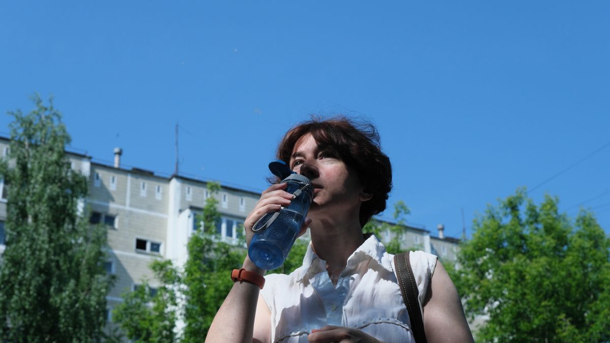 Mature woman is drinking water on city street on a hot summer day
Mature woman is drinking water on city street on a hot summer day
invizbk