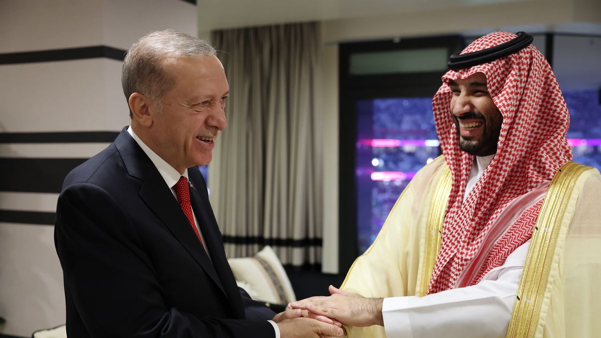 DOHA, QATAR - NOVEMBER 20: Turkish President Recep Tayyip Erdogan (L) and Crown Prince of Saudi Arabia Mohammed bin Salman Al Saud (R) shake hands as he attends a reception hosted by Qatari Emir Sheikh Tamim bin Hamad Al Thani for the opening ceremony of the 2022 FIFA World Cup in Qatar on November 20, 2022. (Photo by Murat Kula/Anadolu Agency via Getty Images)